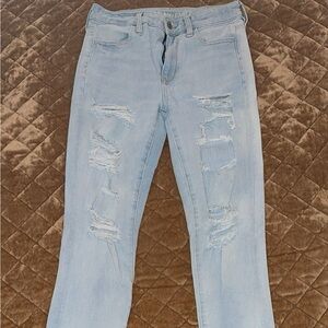 American Eagle 360 next level stretch light wash distressed skinny jeans
